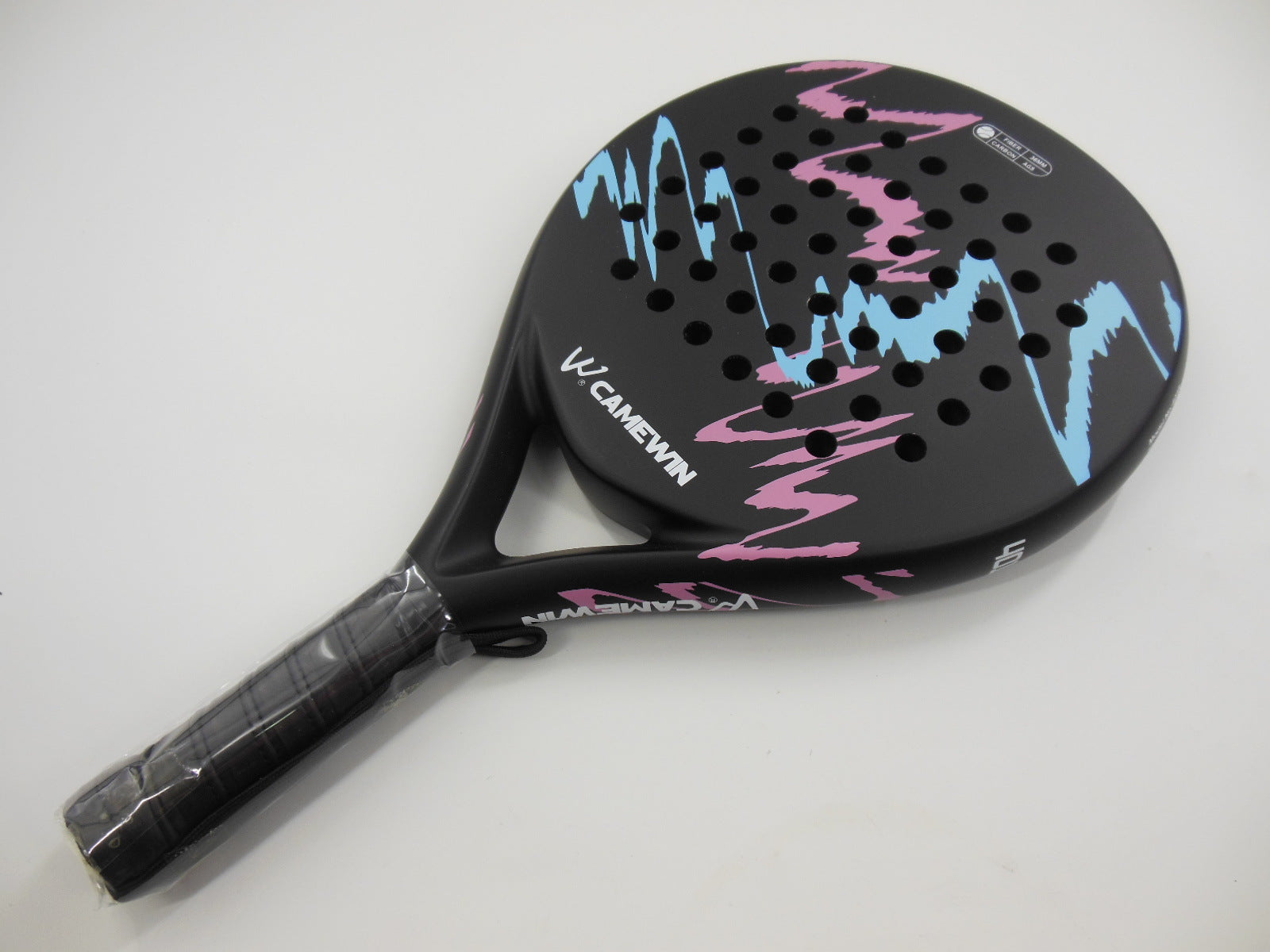 Presura beach tennis racket showing carbon frame and cushioned grip